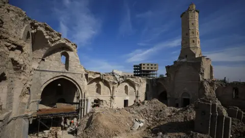 Reuters Palestinian workers clear rubble from the courtyard of the partially-destroyed Great Omari Mosque in Gaza City, northern Gaza