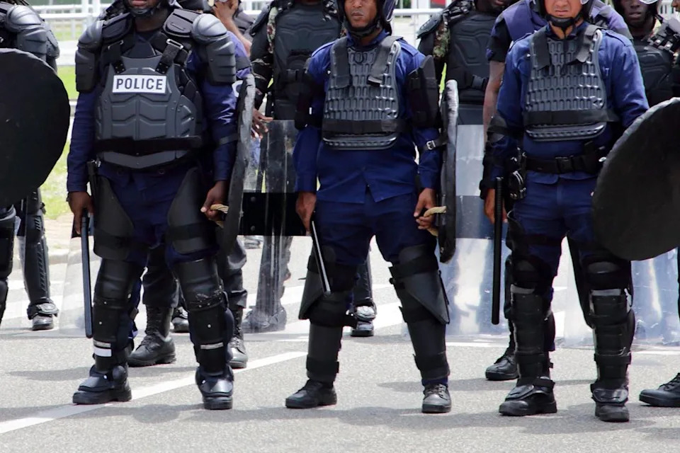 RANU ABHELAKH/AFP via Getty Riot police are photographed in Paramaribo, Suriname, in March 2023.