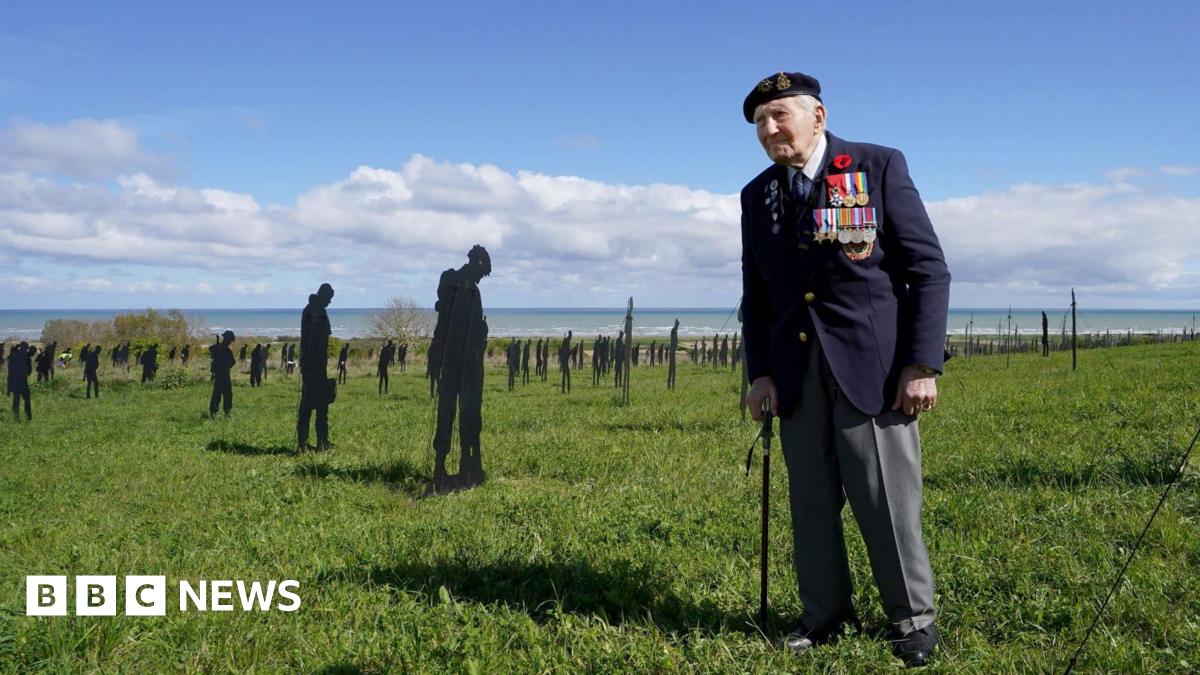 File photo dated 18/04/24 of D-Day veteran and Ambassador for the British Normandy Memorial Mervyn Kersh stands amongst the Standing with Giants silhouettes at the For Your Tomorrow installation at the British Normandy Memorial, in Ver-Sur-Mer, France.