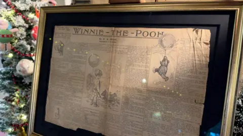 Pooh Corner A framed copy of a newspaper which features a Winnie-The-Pooh story by AA Milne and an illustration