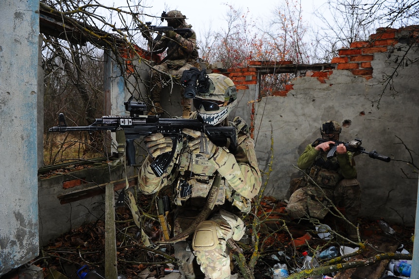 Ukraine's soldiers practice military skills on a training ground