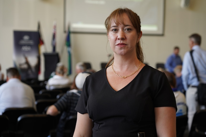 A mid-shot of Rockingham resident Latoya Voogt posing for a photo indoors in a black top.