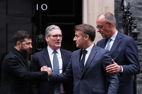 Getty Images Ukraine's President Volodymyr Zelensky, Britain's Prime Minister Keir Starmer, France's President Emmanuel Macron and Germany's Chancellor Friedrich Merz on the 10 Downing Street doorstep