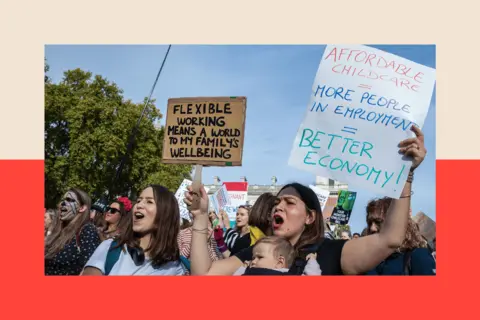 Getty Images Protesters with banners about affordable childcare and family wellbeing