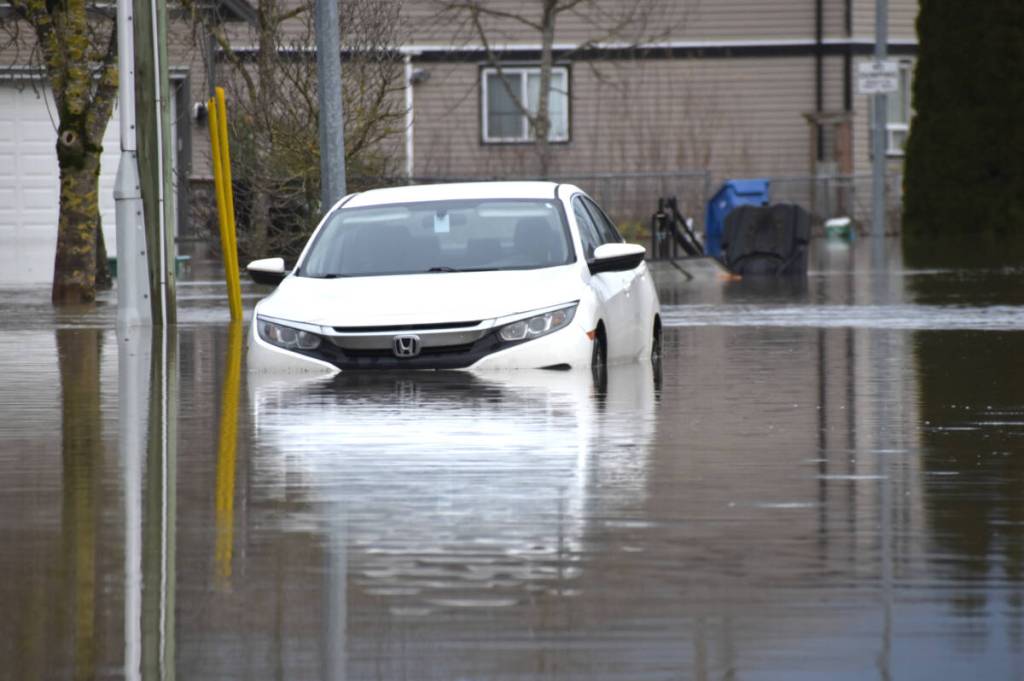 A car is abandoned on 1st Avenue in Abbotsford&rsquo;s Huntingdon Village area. (Ben Lypka/Abbotsford News)