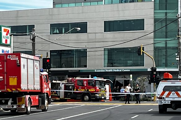 A pedestrian died at the scene, while a woman inside the building was also struck and airlifted to hospital.