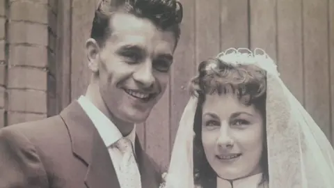 Supplied A black and white wedding photo of a young couple. The man has 