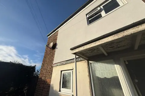 LDRS Brick and concrete 1970s style house 