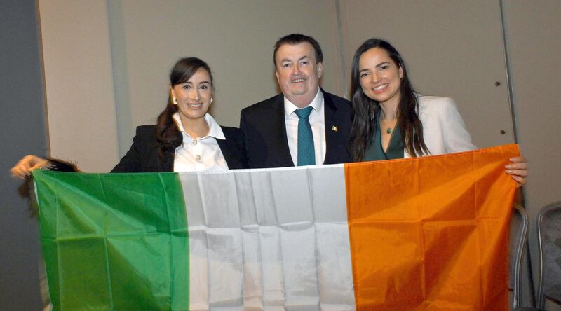 Migration minister Colm Brophy with new Irish citizens Mirella Lucas De Carvalho and Caroline Nogueira Lourence.