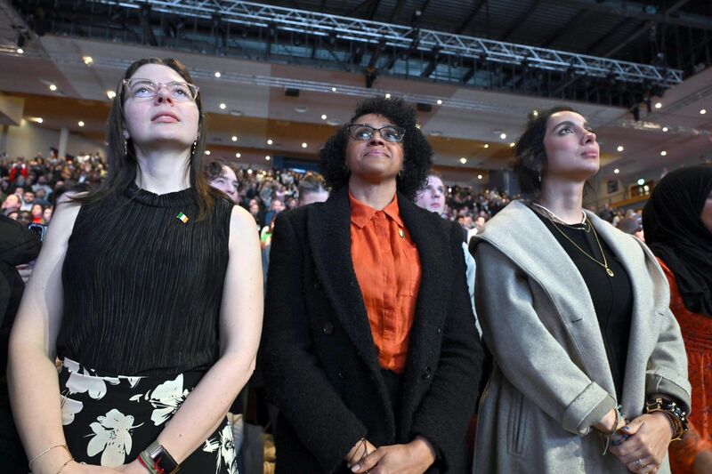 New Irish citizens stand for the national anthem.