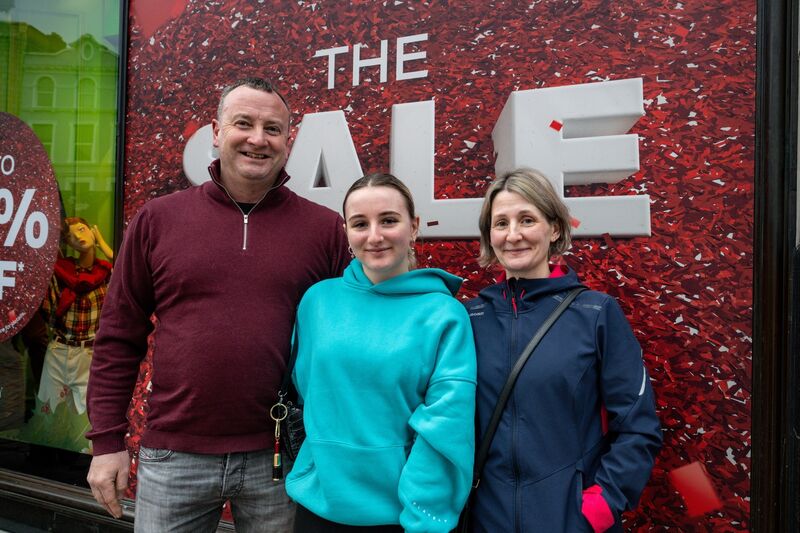 Fergal, Freya and Shawna Shine brave the early start as they line up outside Brown Thomas.