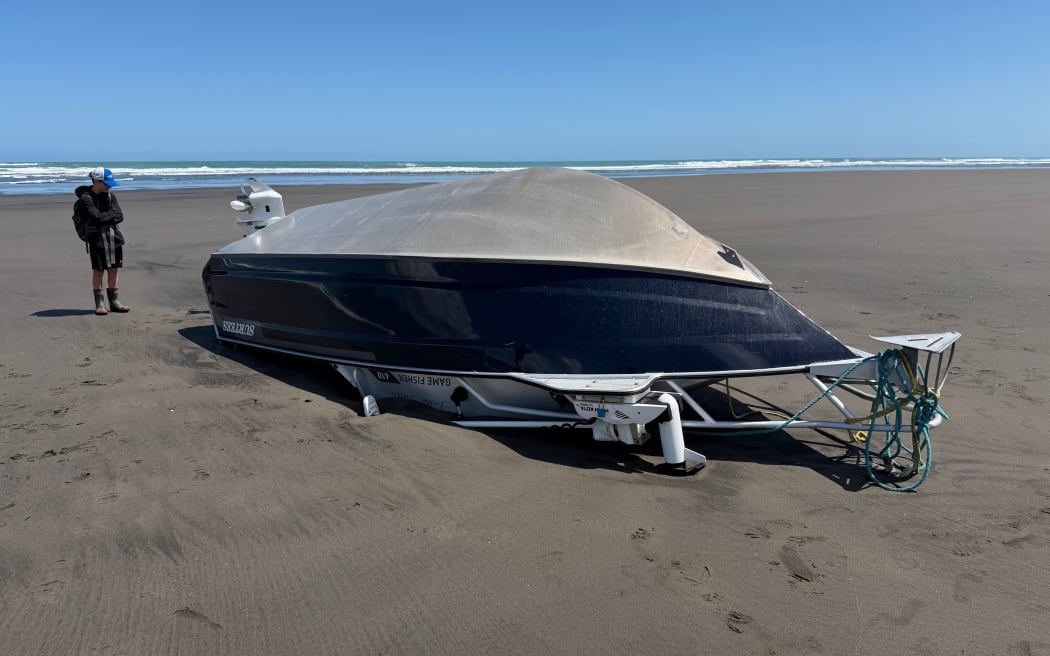 Darren Teague and his boat that capsized on the Raglan Bar on 1 November.