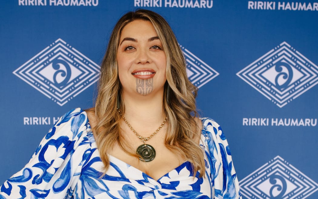 Photo of a woman smiling at the camera.