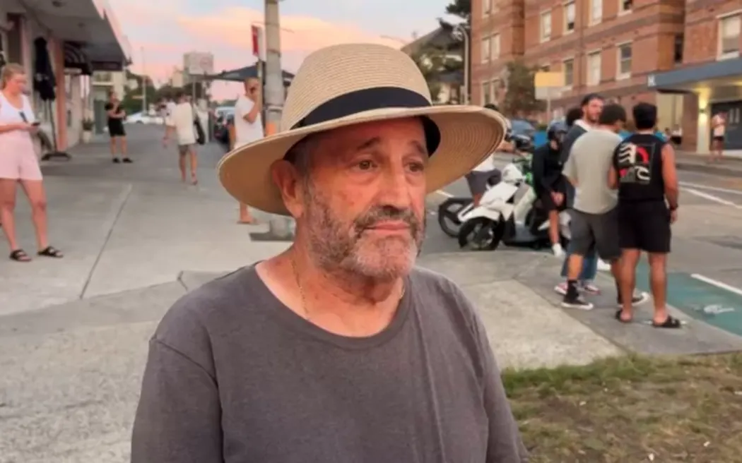 Richard Hasten took cover with a woman who was shot at Bondi.