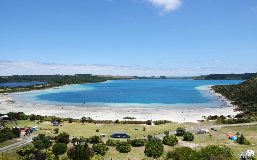 The intense blue of Lake Taharoa as seen from a campground hilltop.