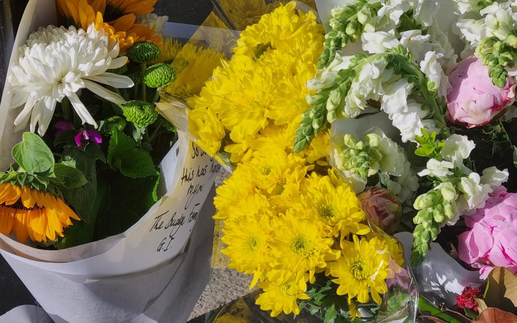 Flowers left at scene of fatal bus passenger attack in Glen Innes