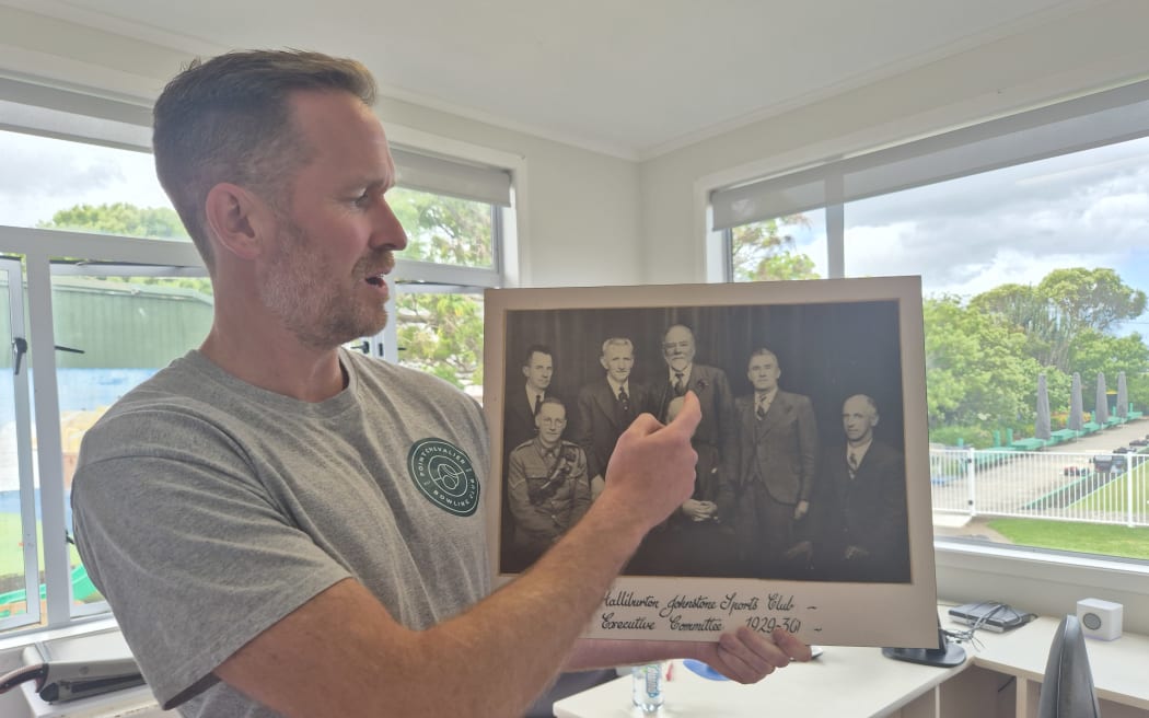 Bowls Club president Simon Munro points out Hallyburton Johnstone, who donated his land in Point Chevalier in 1927 to be used for community sports and recreation.
