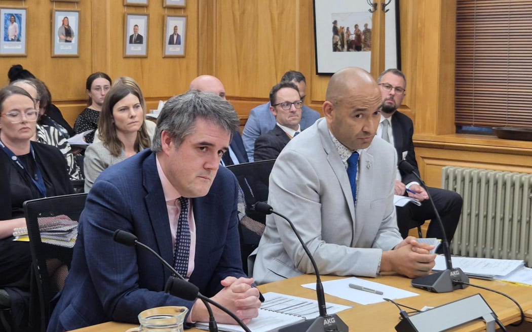 Housing Minister Chris Bishop (left) and Associate Housing Minister Tama Potaka (right) taking questions at a Select Committee.