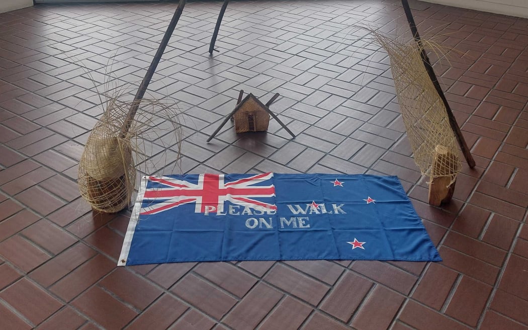 An artwork at the Hastings Art Gallery inviting people to walk on the New Zealand flag has raised concerns from a Hastings District Councillor and a local resident.