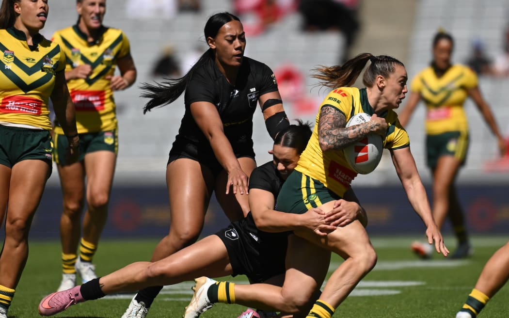 Australian wing Julia Robinson takes on the Kiwi Ferns in round three of the Pacific Championship rugby league tournament at Eden Park, Auckland, 2 November 2025.
© Photo: Andrew Cornaga / Photosport