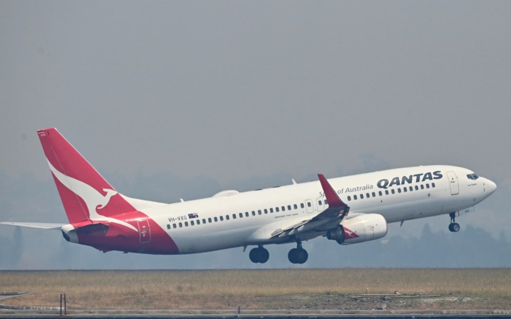 A Qantas Boeing 737-800 takes off from Sydney's Kingsford Smith airport in Sydney on November 1, 2019. (Photo by PETER PARKS / AFP)