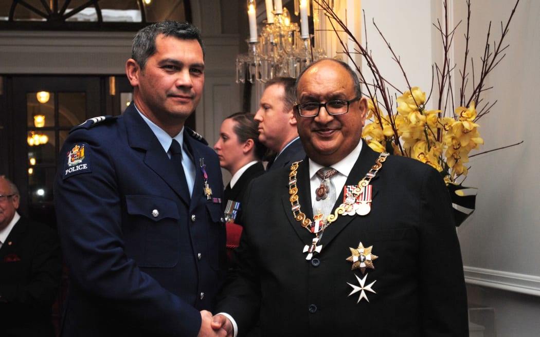 Sergeant Heath Courtenay Jones (left) with then Governor-General Sir Anand Satyanand after receiving the New Zealand Bravery Decoration on 29 June 2011.