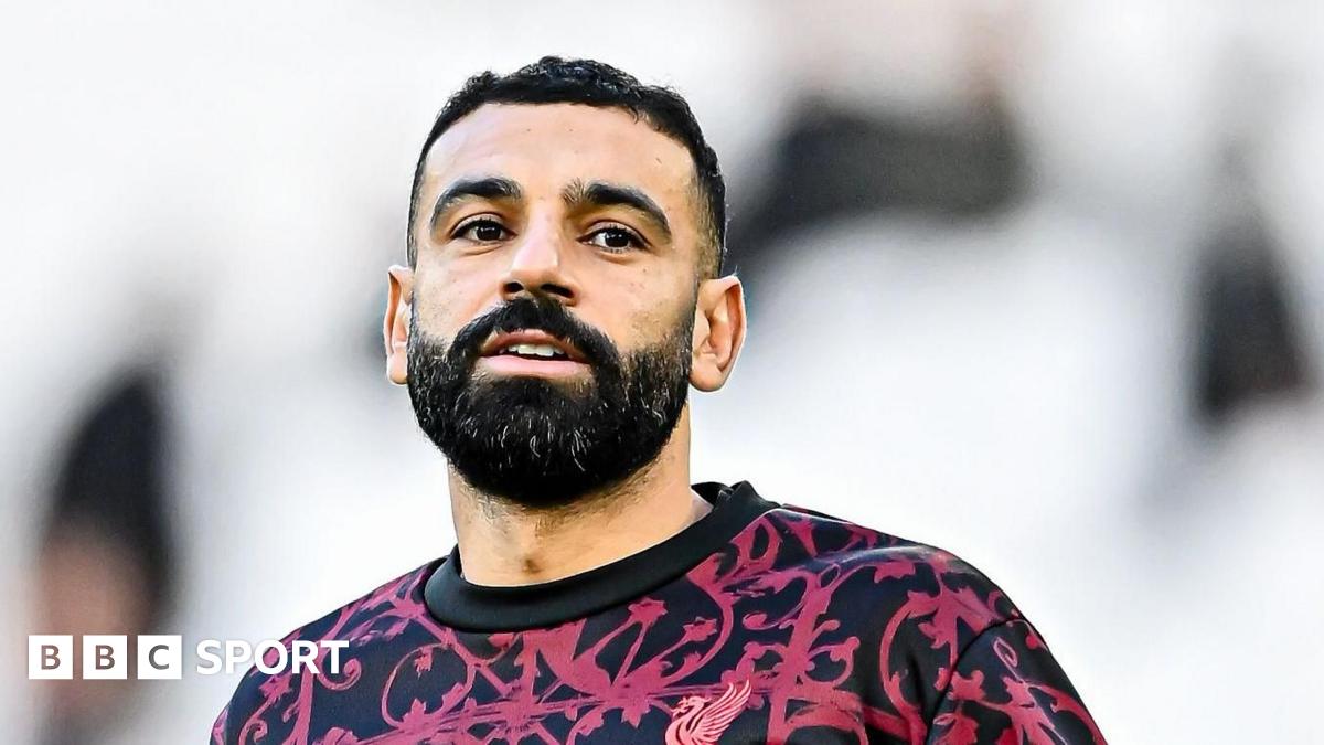 Liverpool's Mohamed Salah on the substitutes' bench