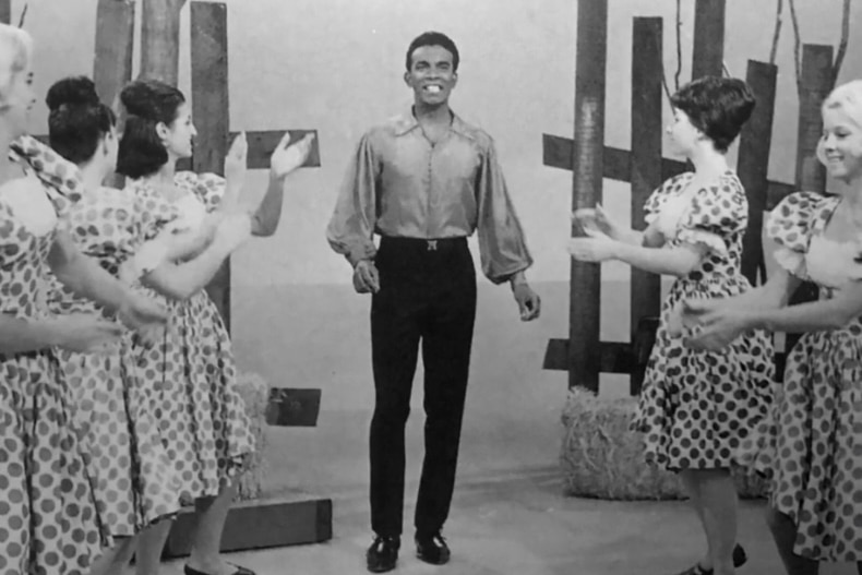 black and white photo of kamahl