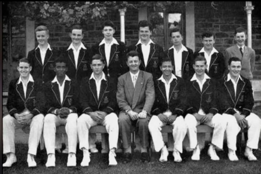 Kamahl in a black-and-white cricket team photo