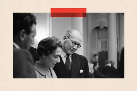 Mirrorpix/Getty Images Sir John Wolfenden (right) meets members of the press at the Waldorf Hotel (black and white image)