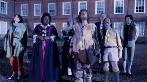 BBC/Monumental/Guido Mandozzi The cast of Ghosts outside West Horsley Place in Surrey