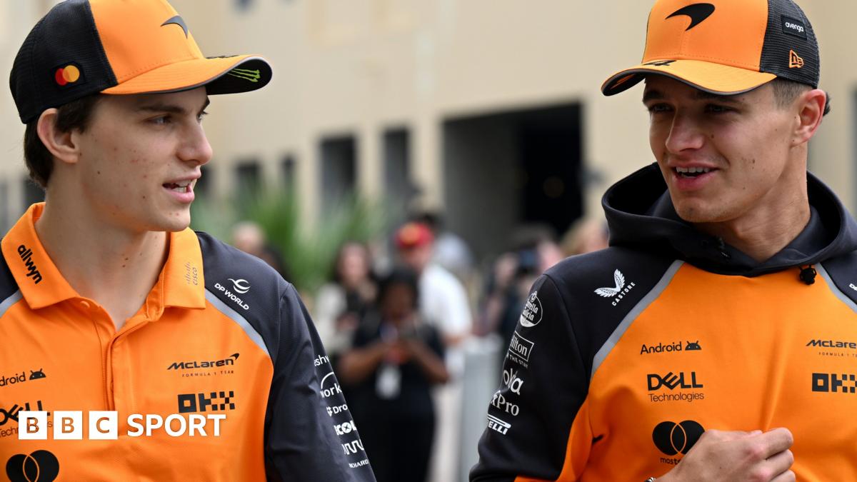 McLaren drivers Oscar Piastri and Lando Norris having a conversation as they arrive at the Abu Dhabi Grand Prix on Friday