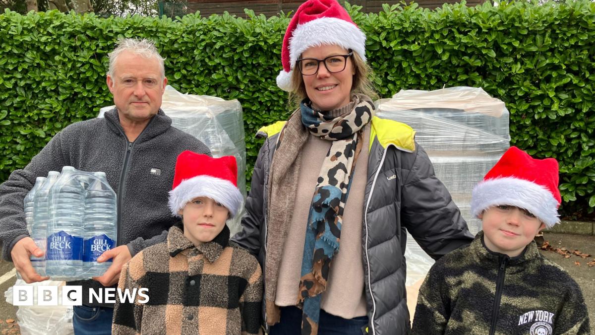 The Anderson family from Bayleys Hill Sevenoaks collecting bottled water at the Solefields Road Car Park in Sevenoaks.