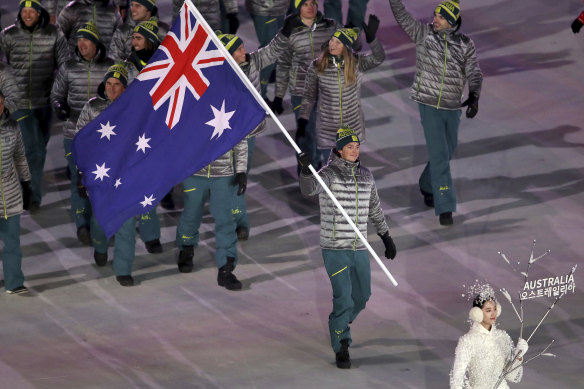 Scotty James carrying the Australian flag during the opening ceremony of the 2018 Winter Olympics in Pyeongchang.