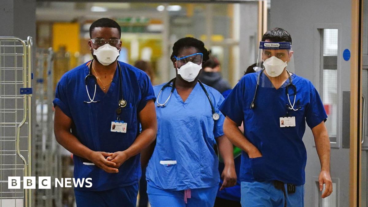 File photo dated 21/12/21 of medical staff wearing FFP3 face masks at King's College Hospital, in south east London.