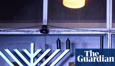 ‘We are reclaiming that light’: Hanukah celebrations tinged with sadness at Heaton Park synagogue | Manchester