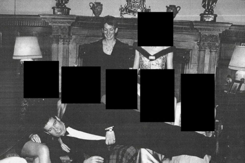 Undated handout photo issued by the US Department of Justice of a photograph appearing to show Andrew Mountbatten-Windsor reclining across the laps of five people has been released in the latest tranche of Epstein files (US DOJ)