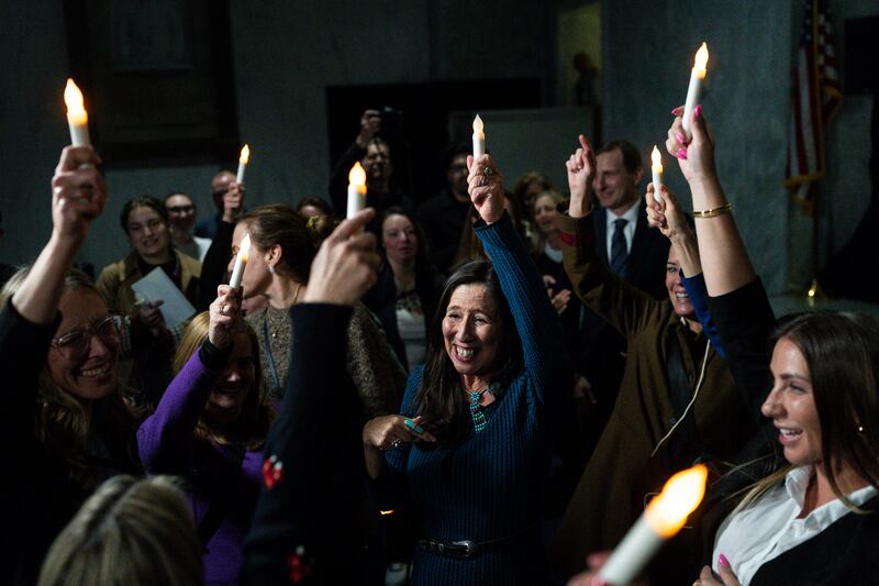 Teresa Leger Fernández, a Democratic member of the House of Representatives, celebrates with victims of Jefrey Epstein after receiving word that the Senate unanimously approved passage of the House’s Epstein Files Transparency Act. Photograph: Tierney L. Cross/The New York Times
                      