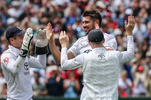 The England side celebrate sending Steve Smith off the pitch