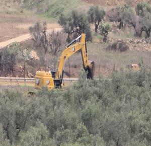 Occupation forces uproot around 400 olive trees, level 35 dunums in village west of Ramallah