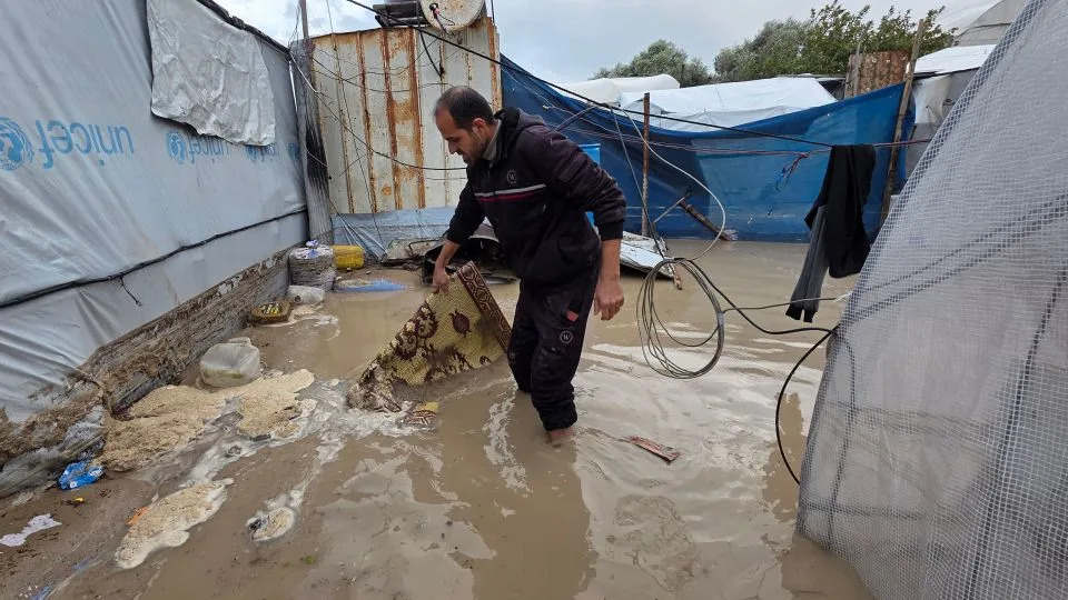 Displaced Palestinians, staying in makeshift tents, struggle to survive in water-logged tents as rain and severe storms affect the Al-Mawasi area, west of Khan Younis, in the southern Gaza Strip, on Sunday. - Tariq Mohammad/APAImages/Shutterstock