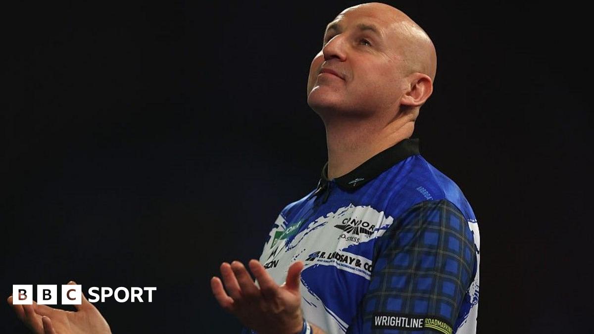 Alan Soutar raises his hands at Alexandra Palace