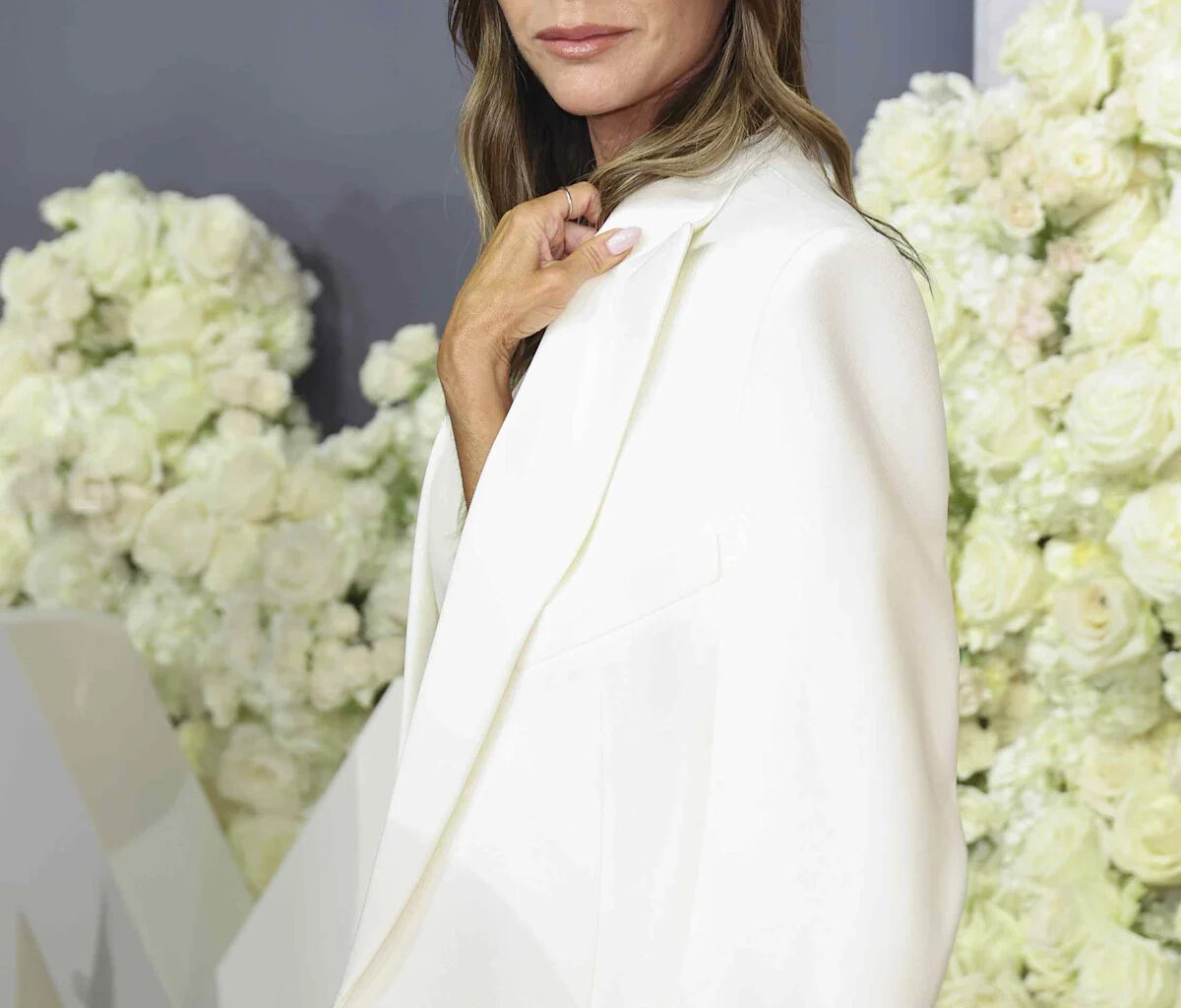 Victoria Beckham's Slinky Emerald Gown Plunges to Her Ribs for a Friend's Wedding With David