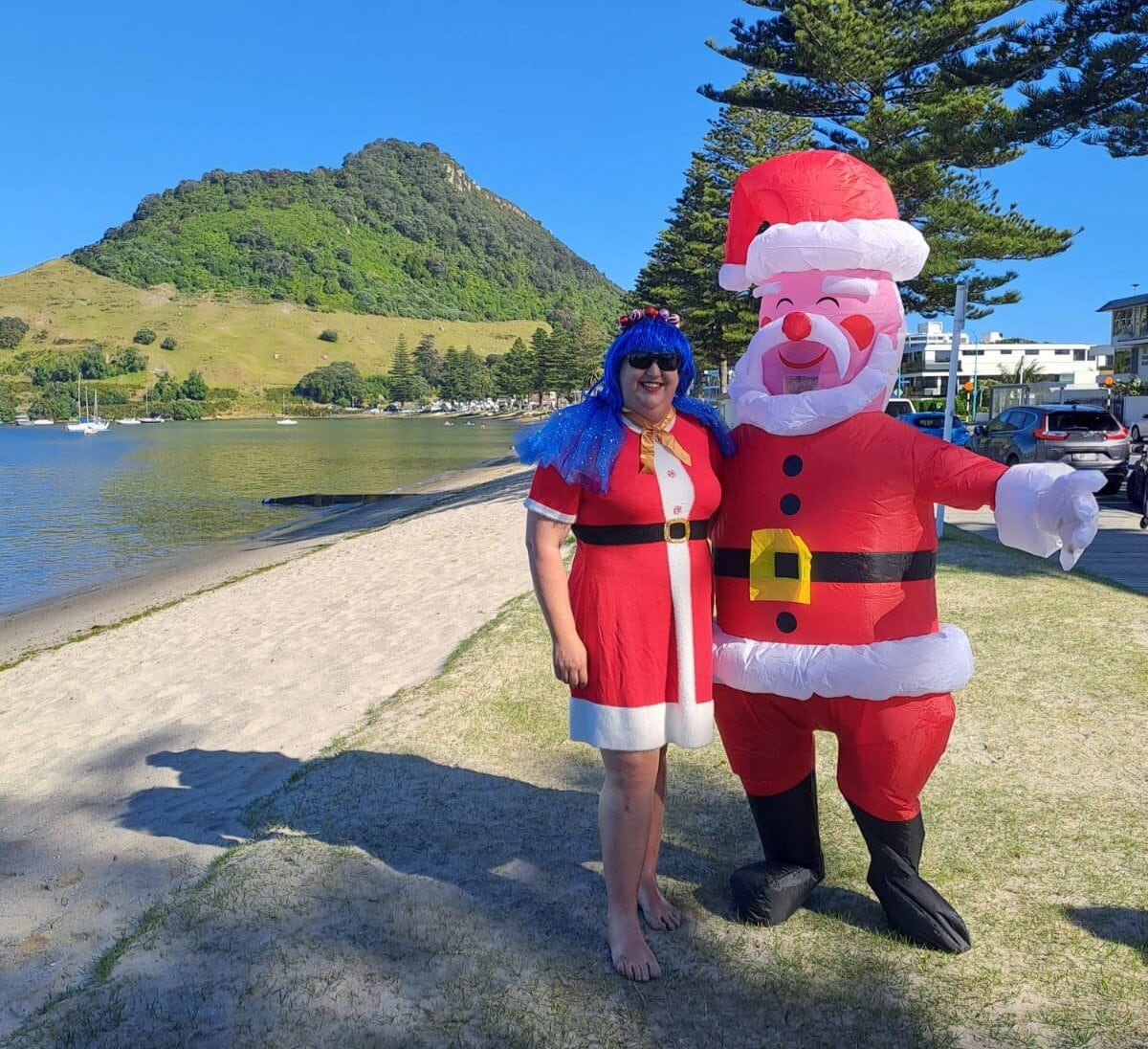  Jemma with Kyle Bryant dressed as Santa near the old Mount Maunganui Yacht Club in Pilot Bay. Photo / Supplied