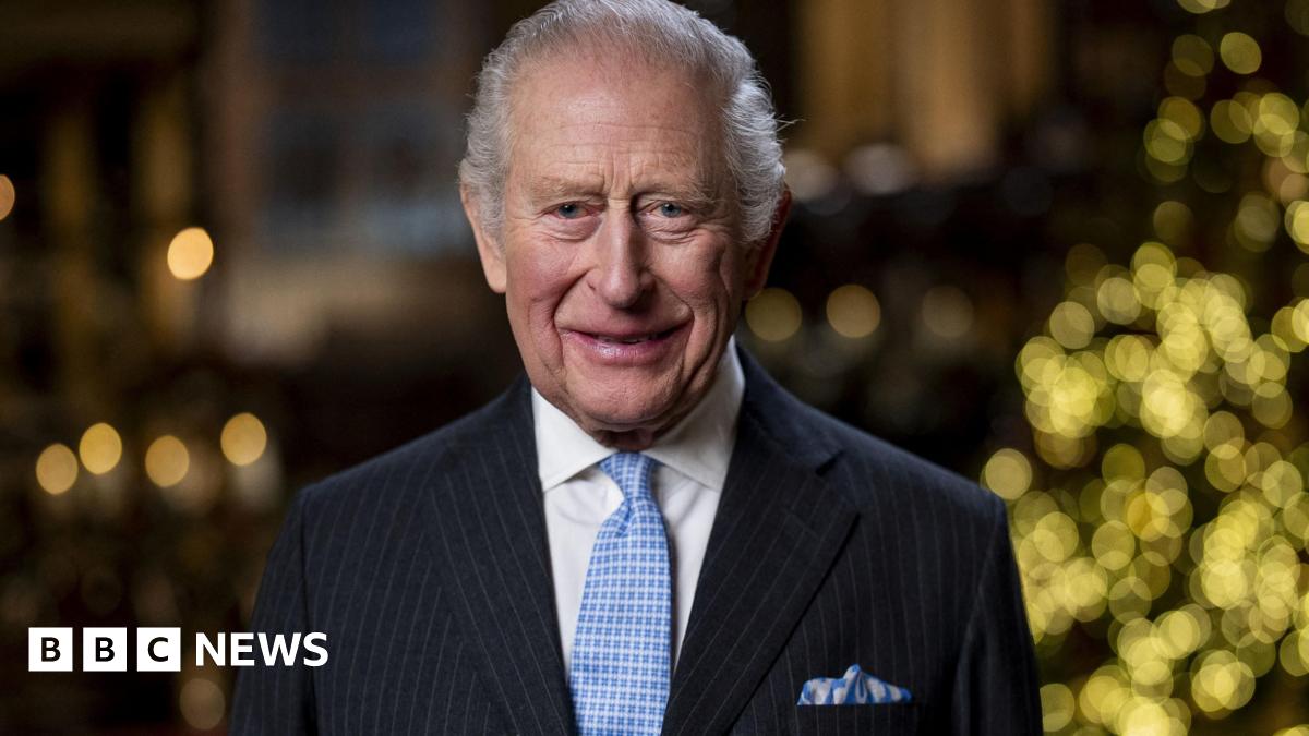 Lady Chapel in Westminster Abbey, with a high vaulted ceiling and colourful heraldic flags