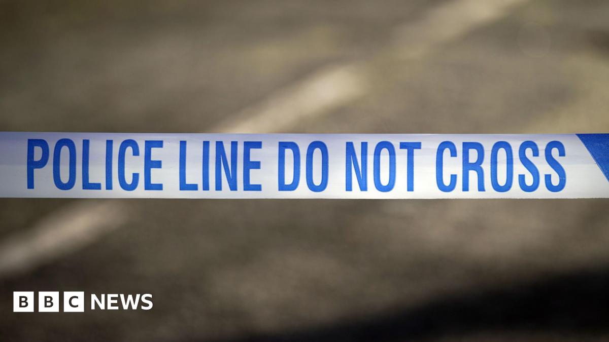 Police tape across a road