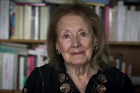 Nobel laureate Annie Ernaux in her book-filled home in Cergy, outside Paris