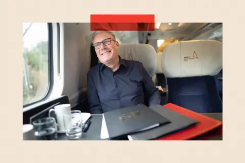 PA Wire Keir Starmer travelling by train