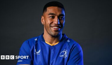 Rieko Ioane poses in a Leinster shirt