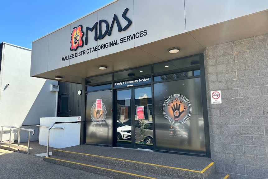 A concrete building with aboriginal